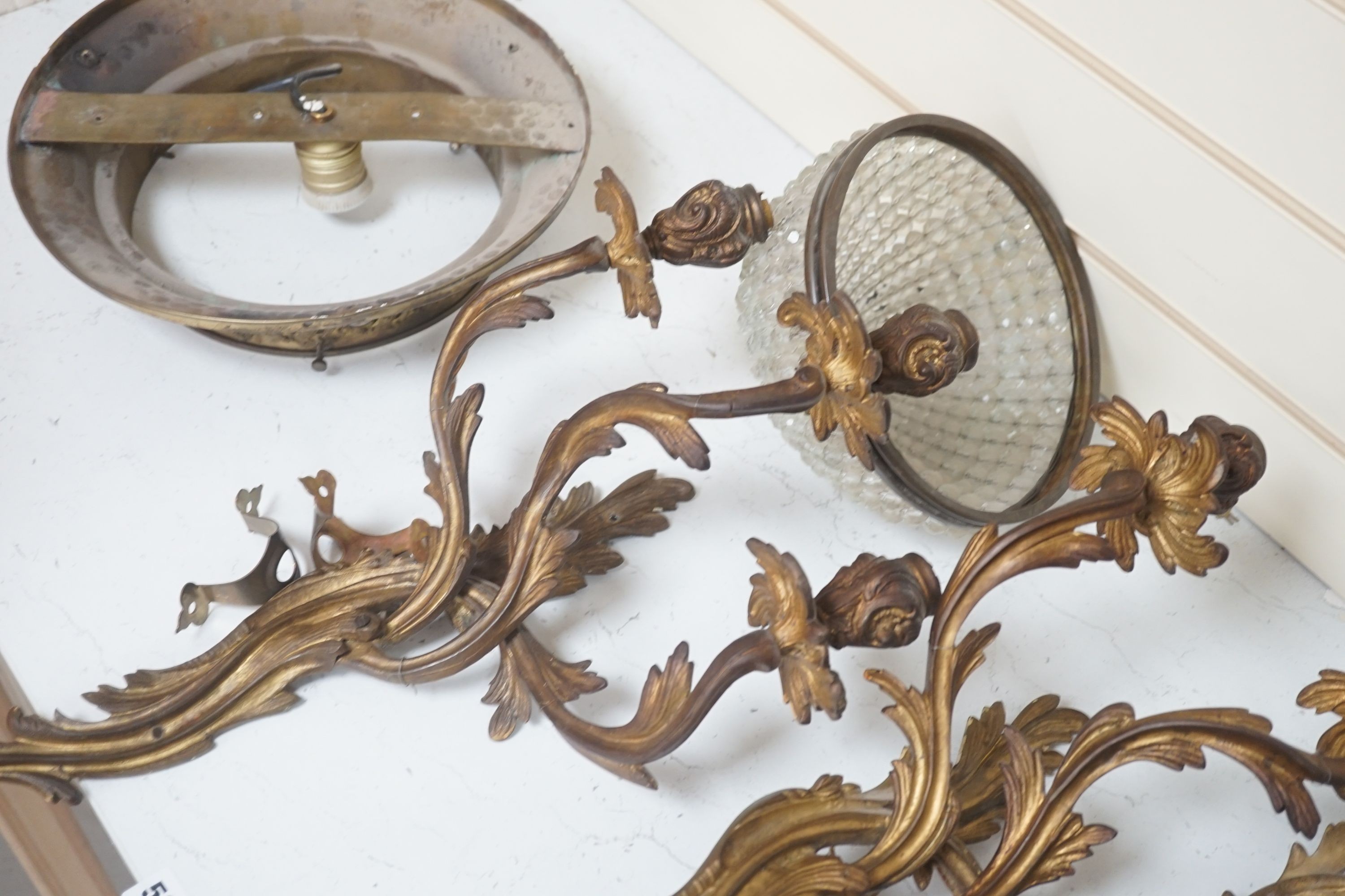 A pair of gilt metal 3 branch wall sconces, a pair of gilt plaster ditto and other light fittings